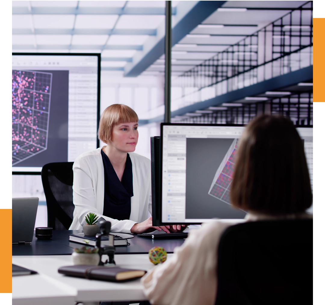 Two women working in modern office.