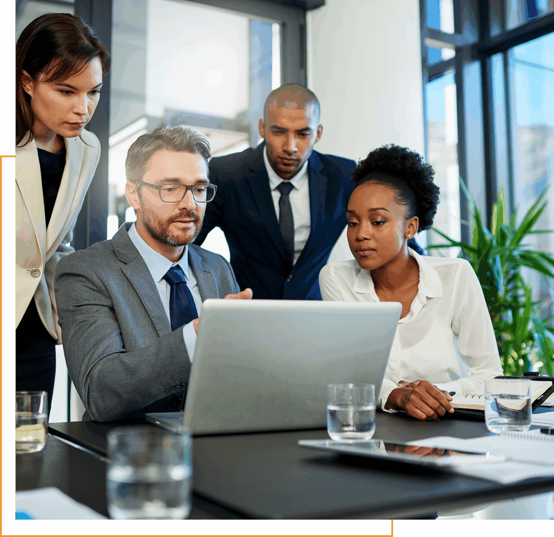 Business team collaborating at a laptop.