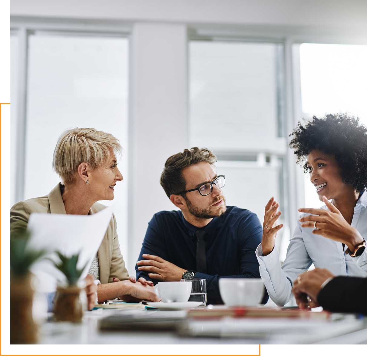 Three people having a business discussion.
