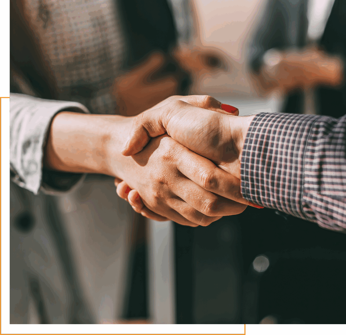 Two people shaking hands in agreement.