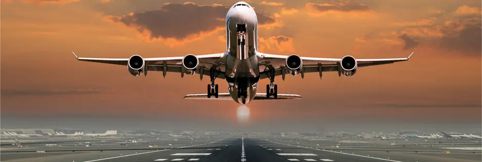 aviation A plane flying low to the ground on an airport runway.